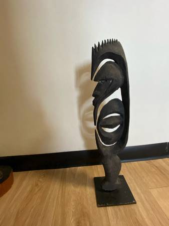 African wood and pained metal sculpture